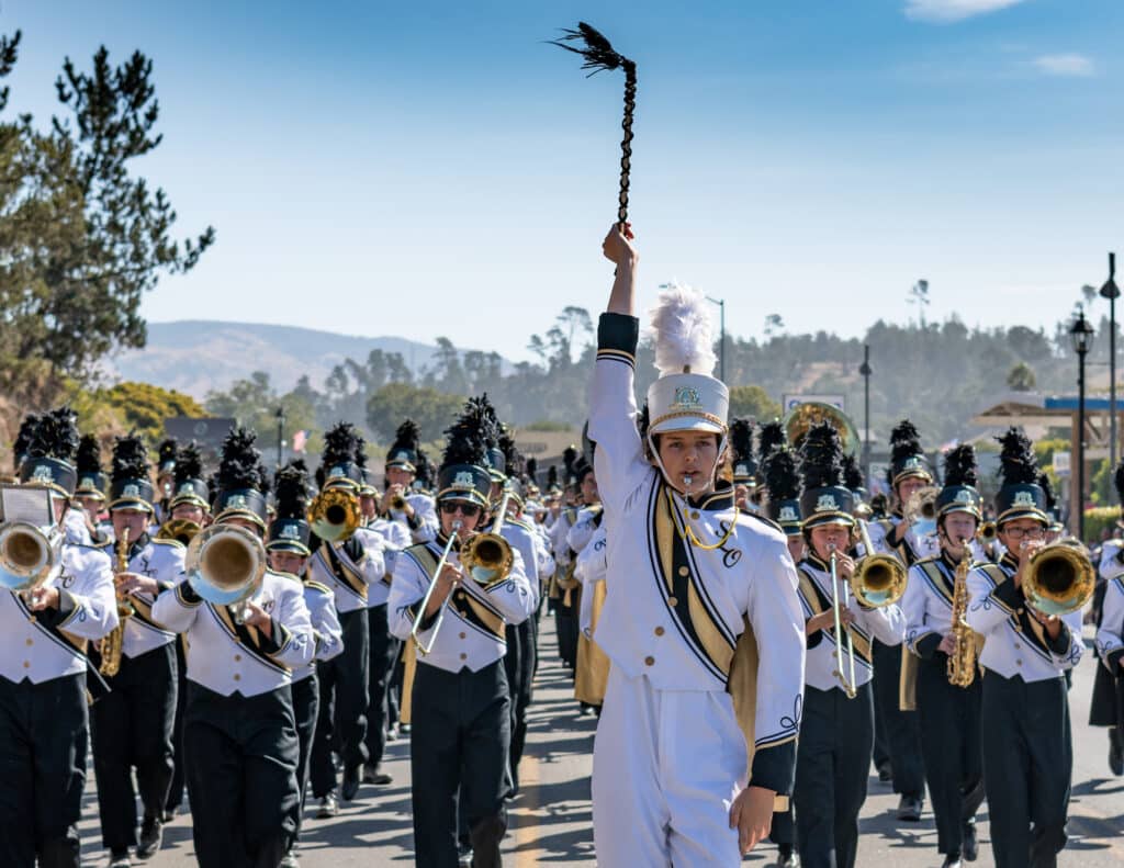 drum major leads the band in a parade